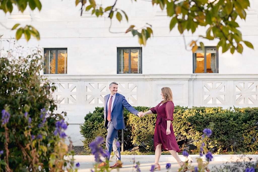 couple walking together in supreme court garden