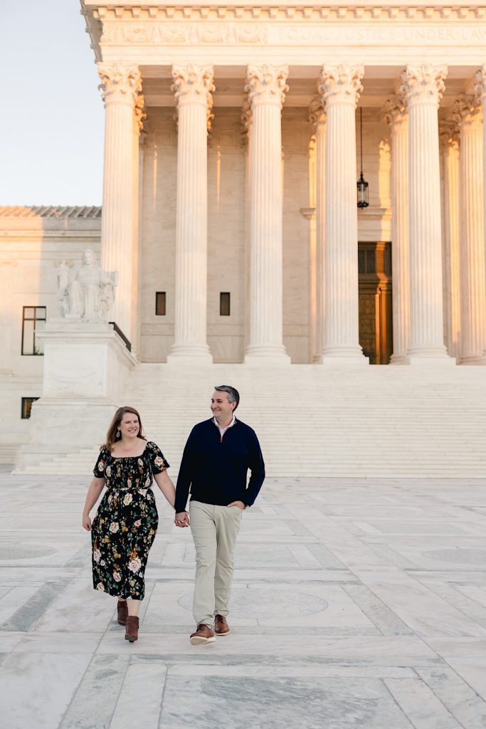 couple walking in front of Supreme Court