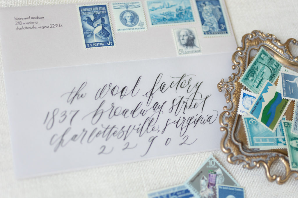 wedding invitation envelope with calligraphy and vintage stamps 