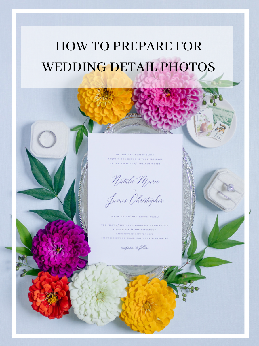 wedding invitation surrounded by bright flowers and wedding rings