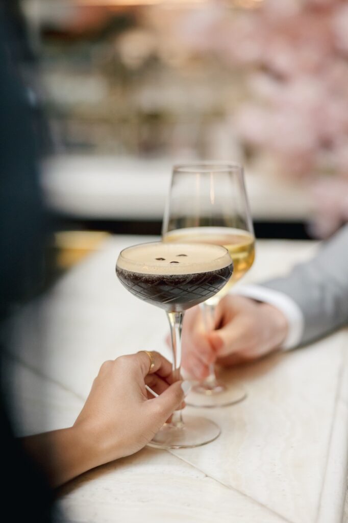 couple holding cocktails on date in Washington DC